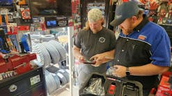 Cornwell Quality Tools Distributor Frank Orphey assisting a customer on his tool truck