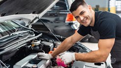 Young technician underhood