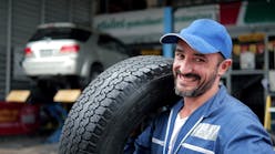 Technician with tire